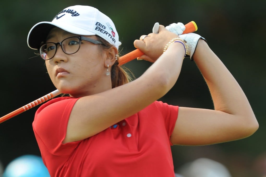 Lydia Ko takes a shot during round one of the 2014 HSBC Women's Champions tournament at the Sentosa Golf Club in Singapore. Photo: AFP