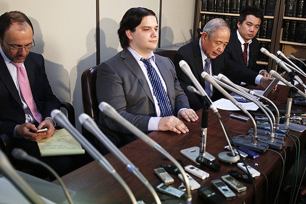 Mt Gox chief executive Mark Karpeles looks resigned as he appears in front of the cameras in Tokyo. Photo: Reuters