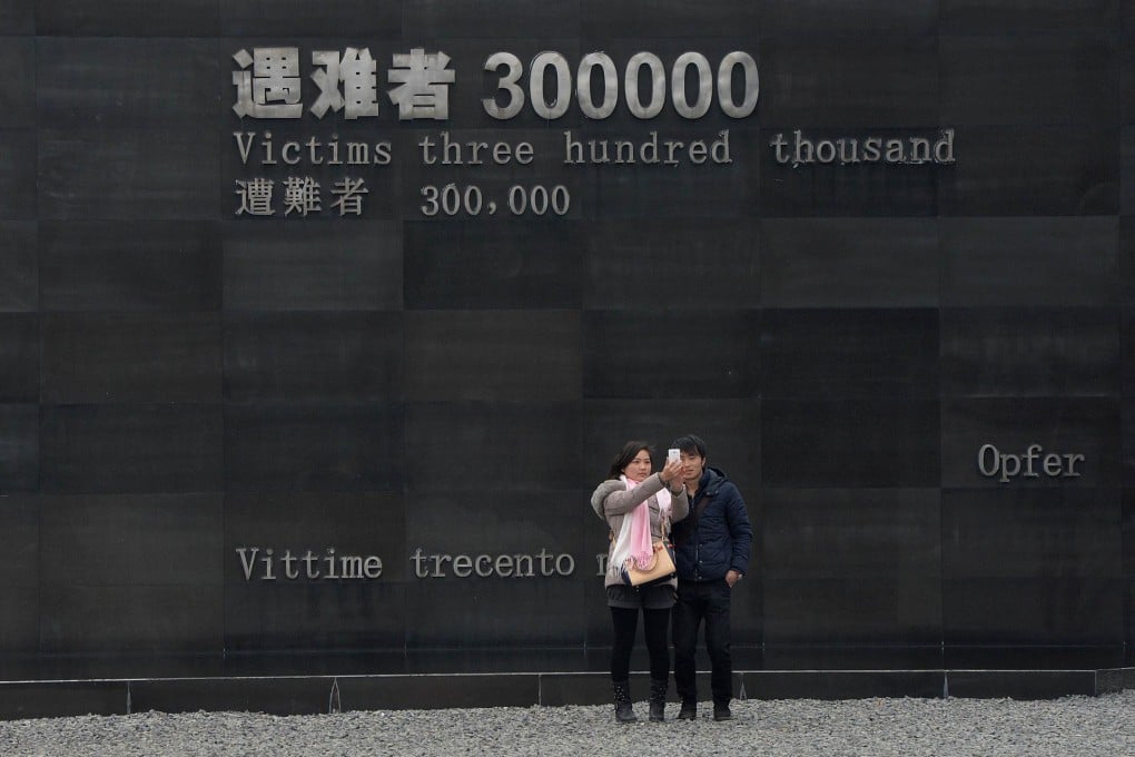 Chinese tourists take a photo at the Nanjing Massacre Memorial Museum in Nanjing earlier last month. Photo: AFP