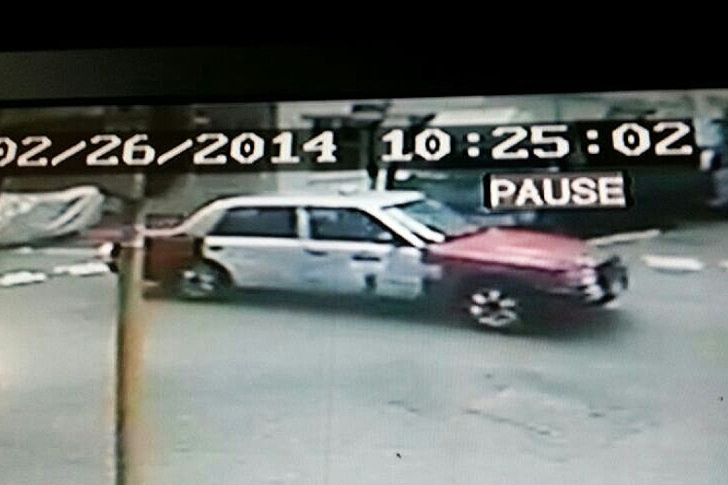 Police are looking for information about a person carrying a helmet who boarded this taxi in Sai Wan Ho Street on the morning of the attack. Photo: SCMP pictures