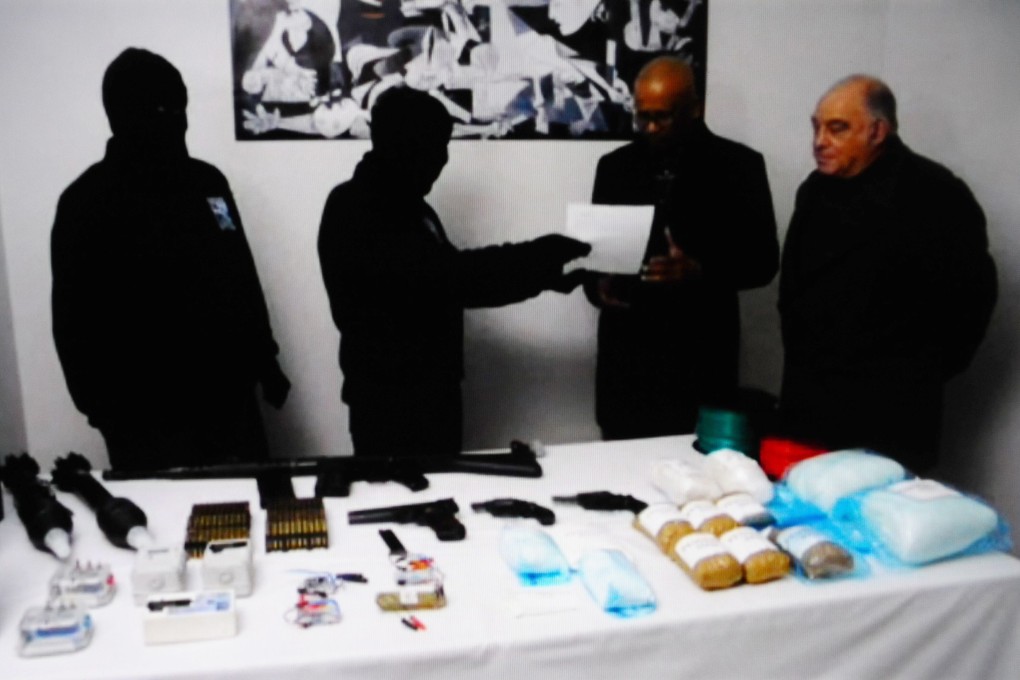 Masked members of ETA with International Verification Commission officials in January. Photo: AFP