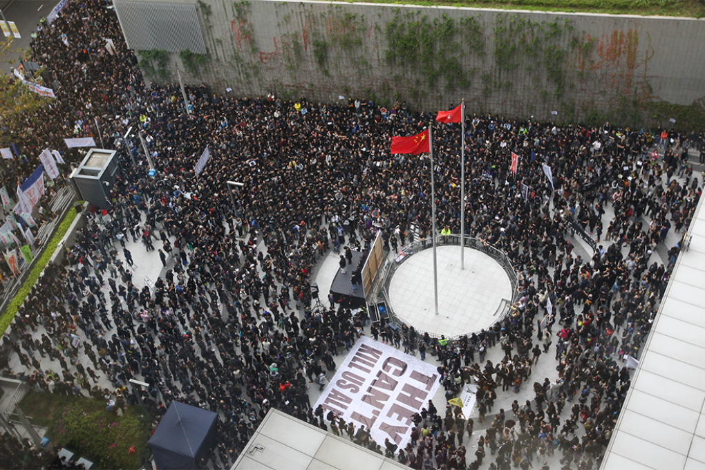 A banner proclaiming "They Can't Kill Us All" is displayed at the government offices in Tamar. Photo: Felix Wong