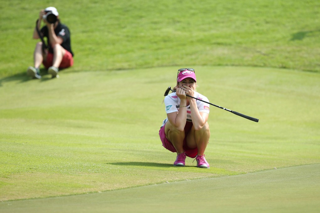 Paula Creamer celebrates after sinking a 75-foot eagle putt to win the HSBC Women's Championships at the Sentosa Golf Club in Singapore. Photo: EPA