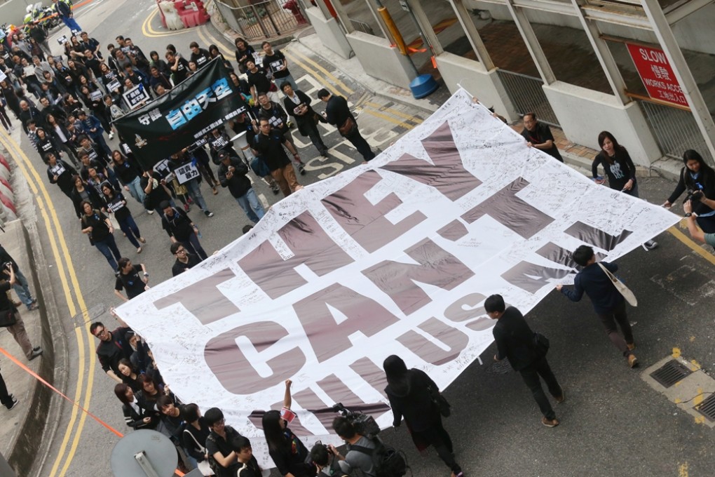 Members of The Hong Kong Journalists Association, Staffs of Ming Pao and supporters hold a banner displaying "They Can't Kill Us All" march from Central Government Offices to police headquarters in support of press freedom. Photo: K. Y. Cheng