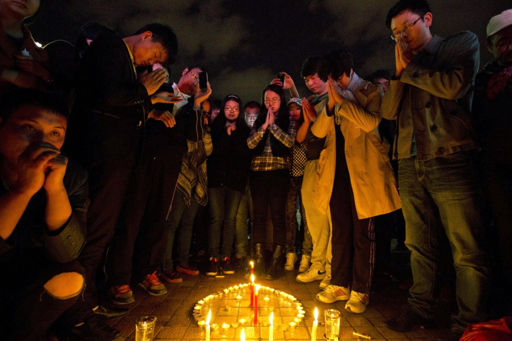 A candlelit vigil is held at Kunming, following the massacre of 29 civilians. Photo: AP