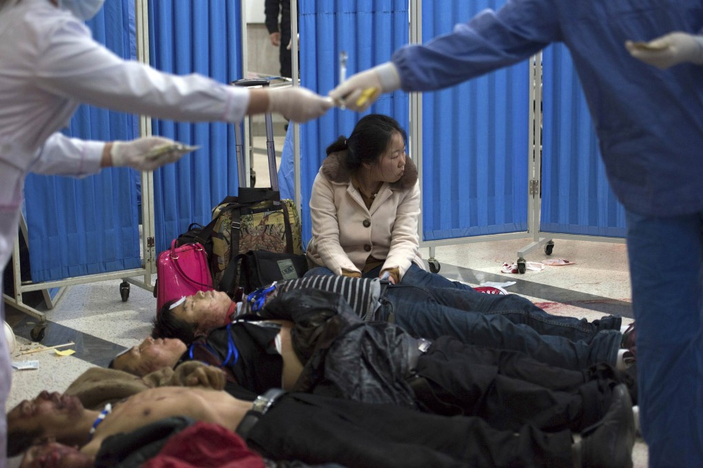 Bodies of victims lie on the floor at a hospital after a knife attack at Kunming railway station, Yunnan province. Photo: Reuters