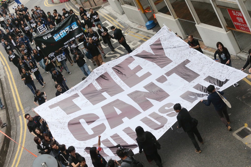 Members of The Hong Kong Journalists Association, Staffs of Ming Pao and supporters hold a banner displaying "They Can't Kill Us All" during the march in support of press freedom. Photo: K. Y. Cheng