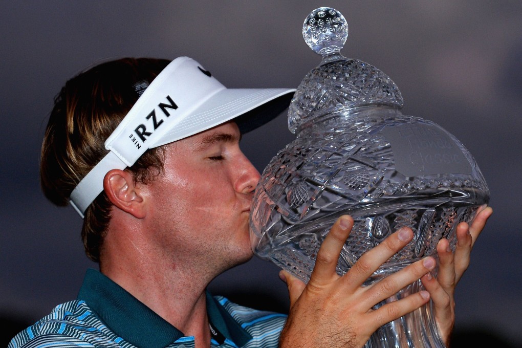 Richard Henley kisses his trophy. Photo: AFP