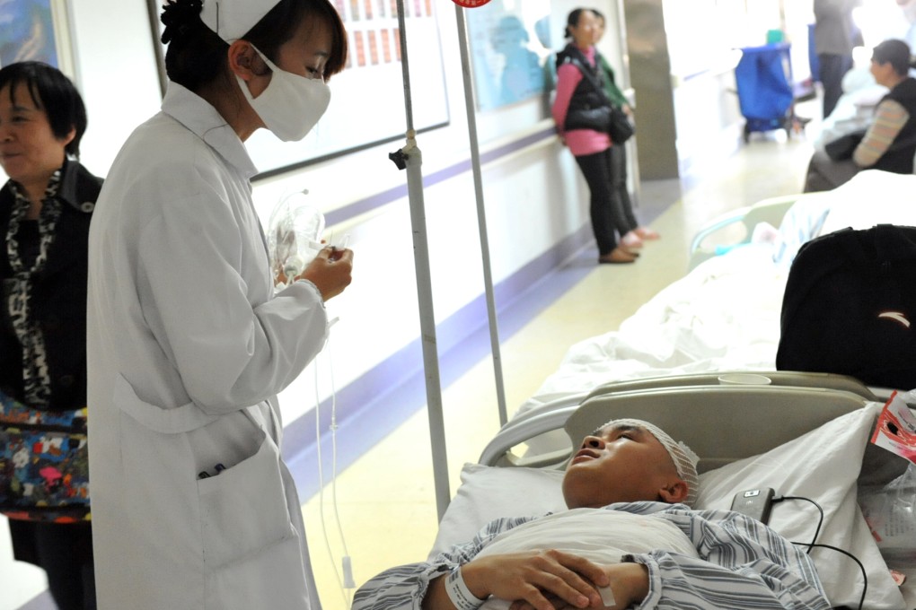 A nurse attends to a patient who was injured in a railway station attack on Saturday. Photo: Xinhua