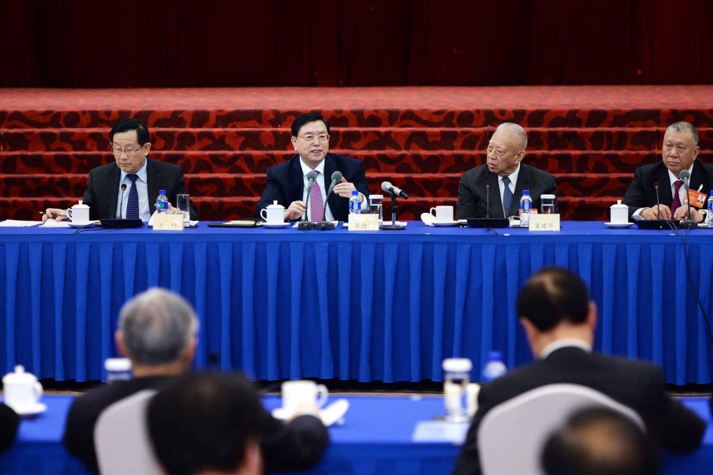 Zhang Dejiang (second left), head of the leading group on Hong Kong and Macau affairs, addresses CPPCC delegates in Beijing. Photo: Xinhua