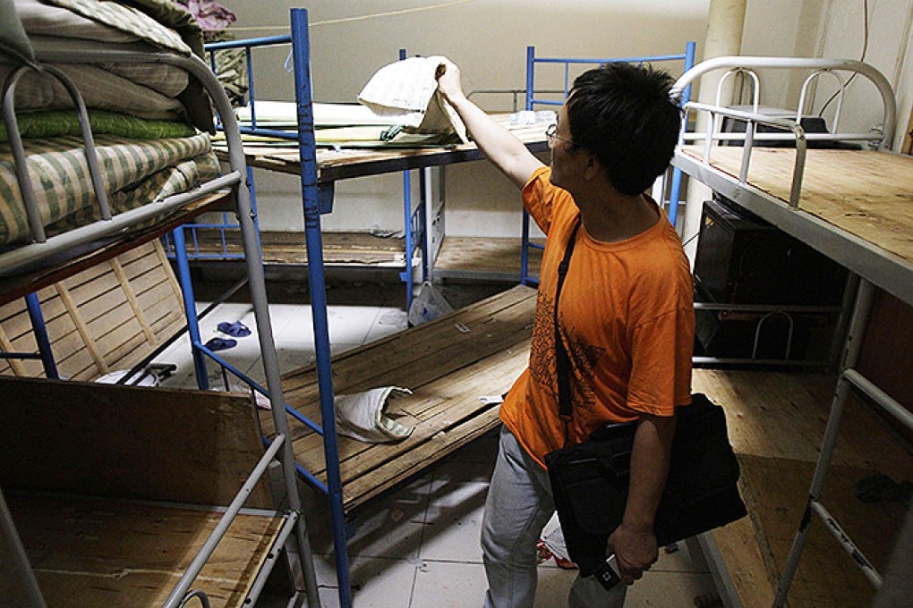 Human rights activist Liu Dejun inspects a "black jail" in Beijing. Photo: AP