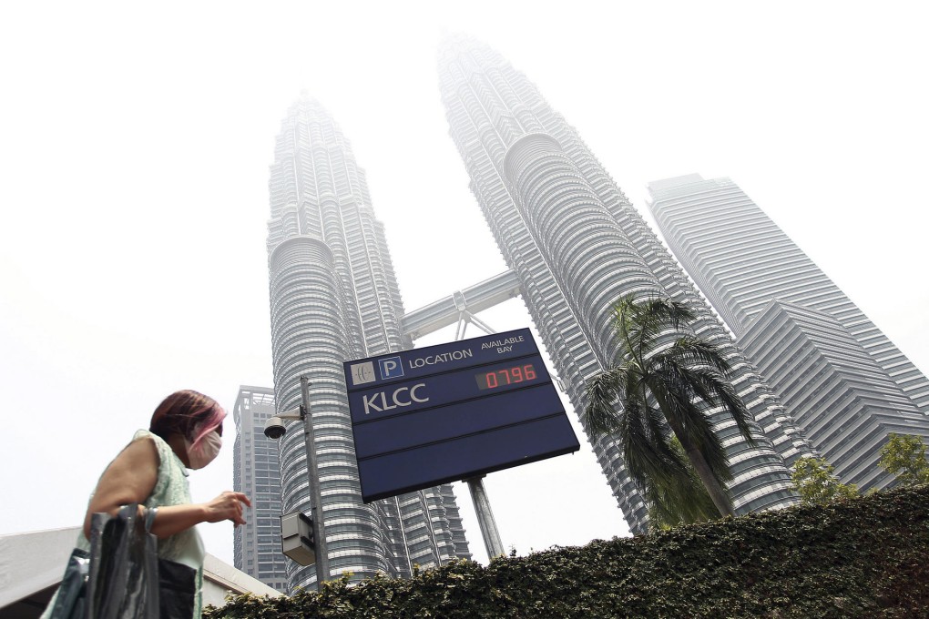 The landmark Petronas Twin Towers are lost in the haze. Photo: AP