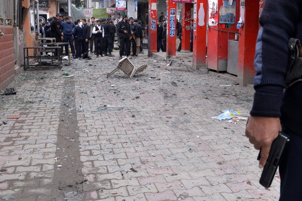 Debris litters the street outside the court in Islamabad. Photo: AFP