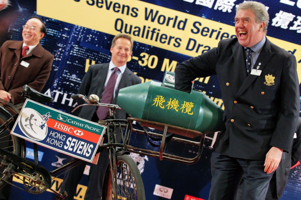 Trevor Gregory (right, drawing from basket), Chairman, Hong Kong Rugby Football Union (HKRFU), attends the Cathay Pacific/HSBC Hong Kong Sevens 2014 Official Draw held at the Confucius Hall Secondary School, So Kon Po. Photo: Nora Tam