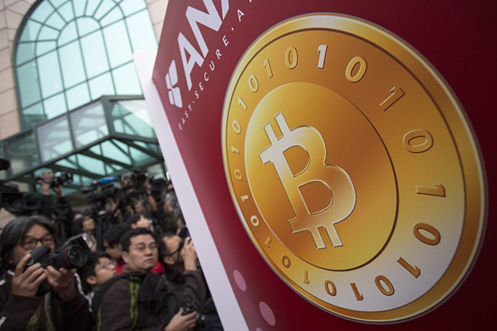 A Bitcoin logo on a display at the opening ceremony of the first Bitcoin counter in Hong Kong, in February. Photo: EPA