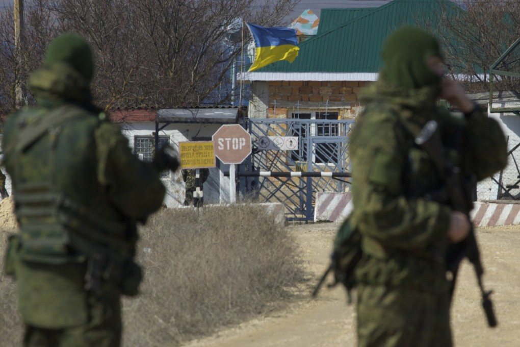 Pro-Russian soldiers block the Ukrainian naval base in the village of Novoozerne. Photo: AP