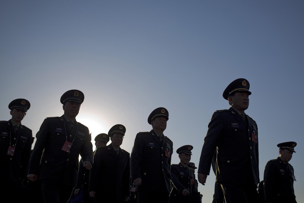 These PLA delegates heard good news about funding. Photo: AP