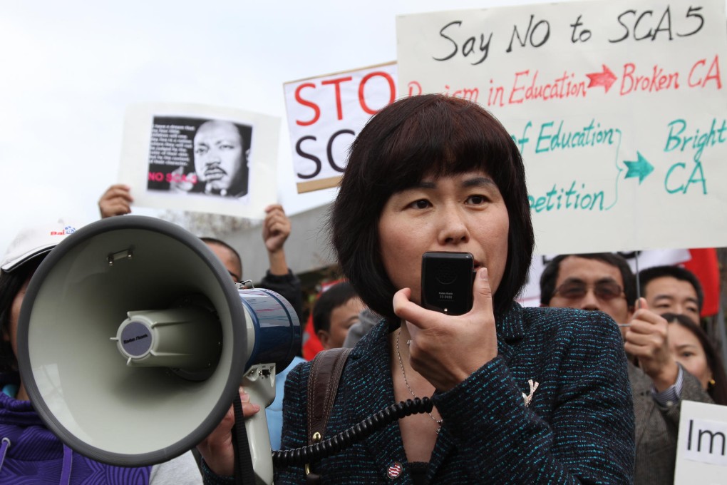A community leader speaks to the crowd at a rally against the proposed college admissions amendment outside the town hall in Cupertino, California. Photo: Guisel Contreras