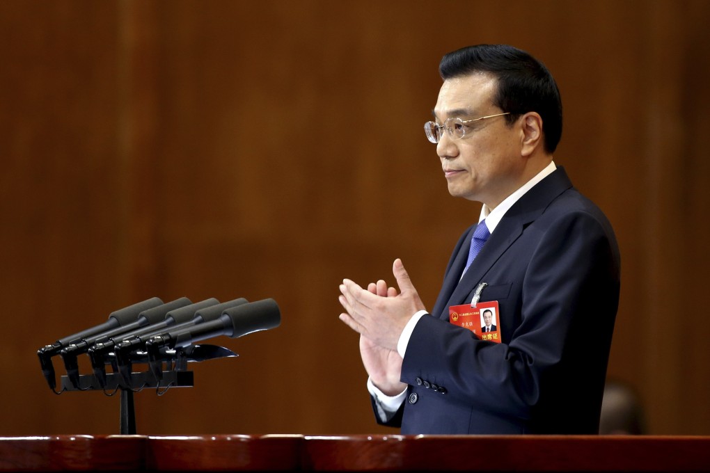 China's Premier Li claps as he delivers the government work report. Photo: Reuters