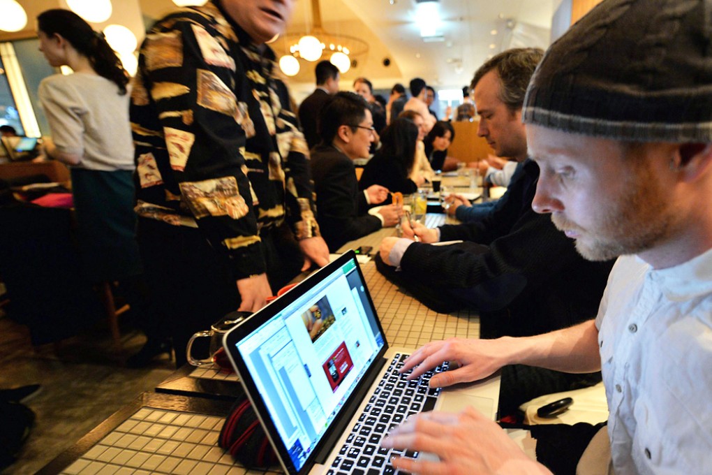 Members of a bitcoin trading club meet in Tokyo on February 27. A US$500 million heist that forced the Japanese exchange Mt Gox into bankruptcy has raised doubts about the bitcoin's ability to emerge as an alternative currency. Photo: AFP