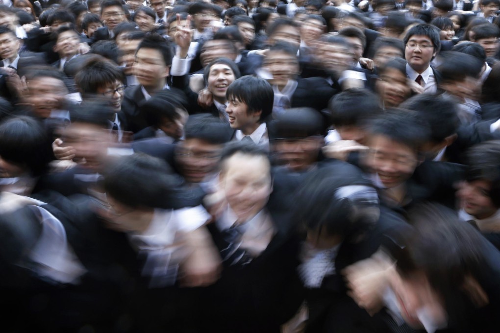 Japanese students during a job hunting rally. Fewer high school graduates are seeking private sector jobs. Photo: Bloomberg