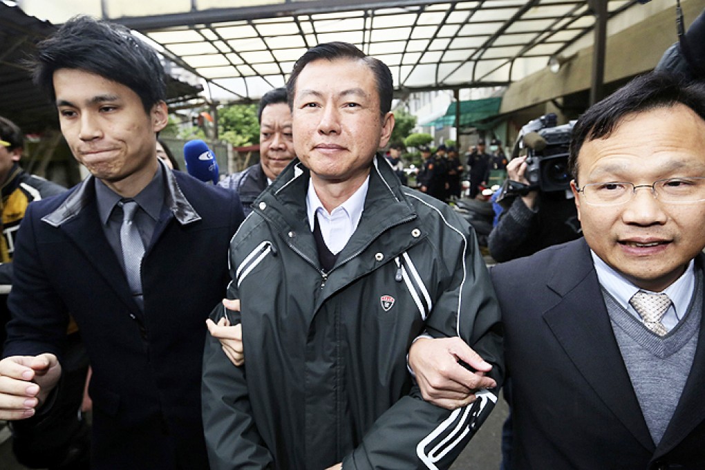 Shen Wei-chih, the former commander of soldier Hung Chung-chiu, walks out of a courthouse after a verdict hearing in Taoyuan on Friday. Photo: Reuters