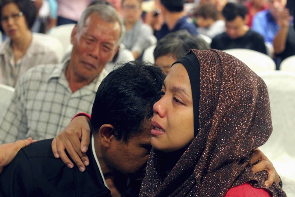 Family members of those onboard the missing Malaysia Airlines flight MH370 cry at a hotel in Putrajaya. Photo: Reuters