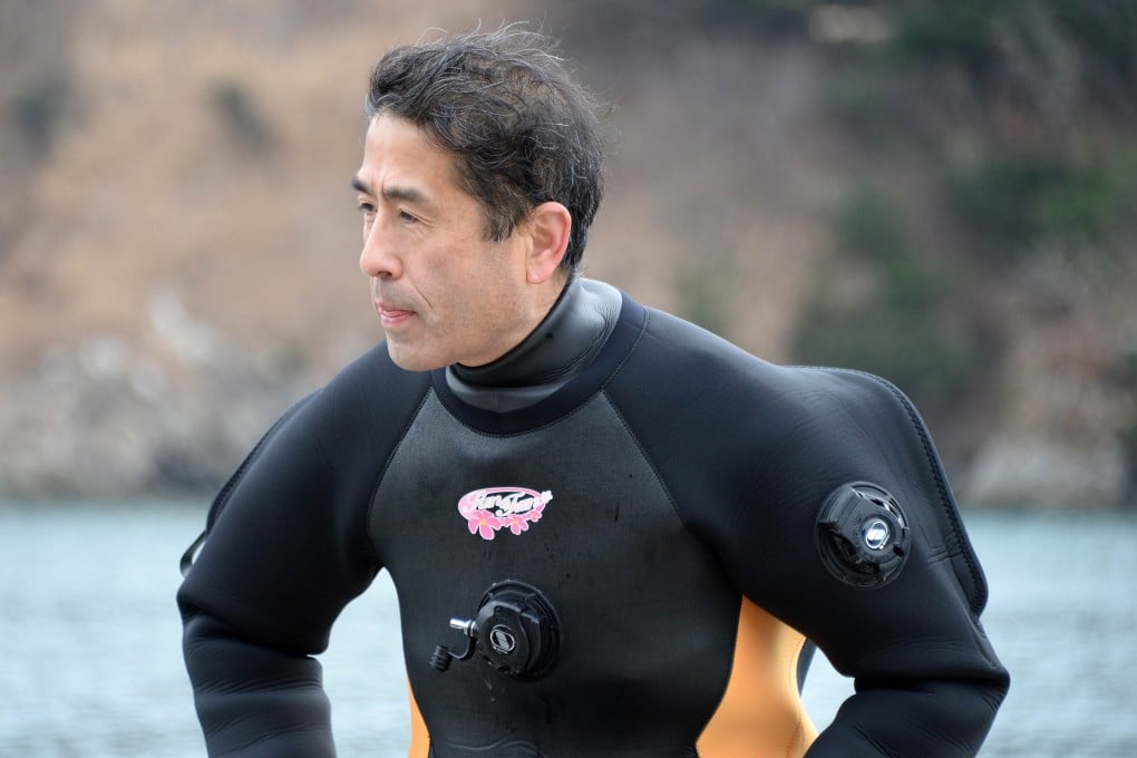 The 57-year-old bus driver started taking scuba diving lessons in November to find his wife who is still missing after the 3/11 tsunami. Photo: AFP
