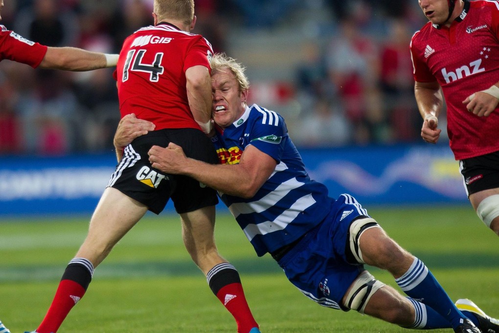 Stormers’ flanker Schalk Burger tackles Crusaders’ back Johnny McNicholl during their clash in Christchurch on Saturday. Photo: AFP