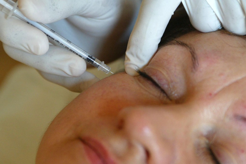 A woman receiving botox treatment
