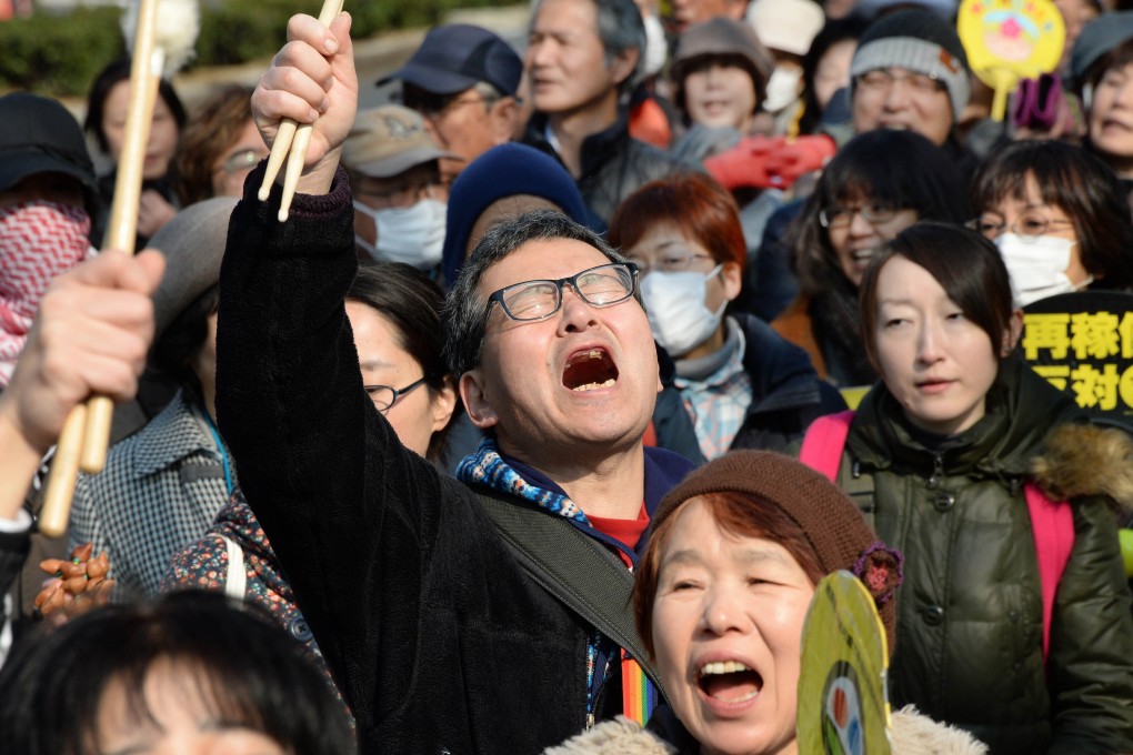 People shout slogans as they march during an anti-nuclear power plant demonstration in Tokyo. Photo: AFP