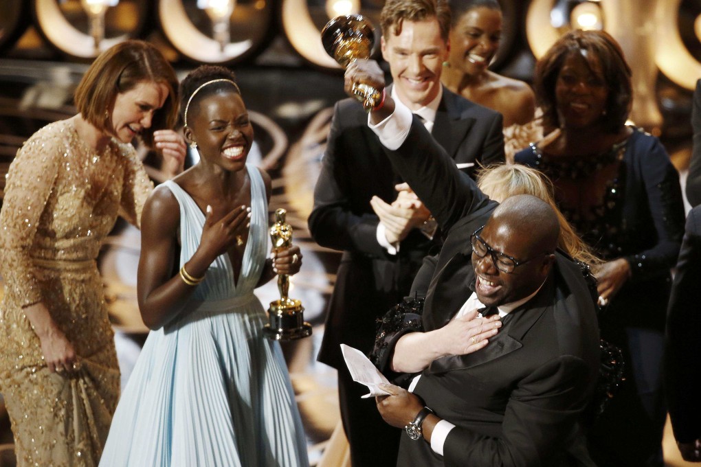 Director and producer McQueen celebrates after accepting the Oscar for best picture for his film "12 Years a Slave" at the 86th Academy Awards in Hollywood. Photo: Reuters