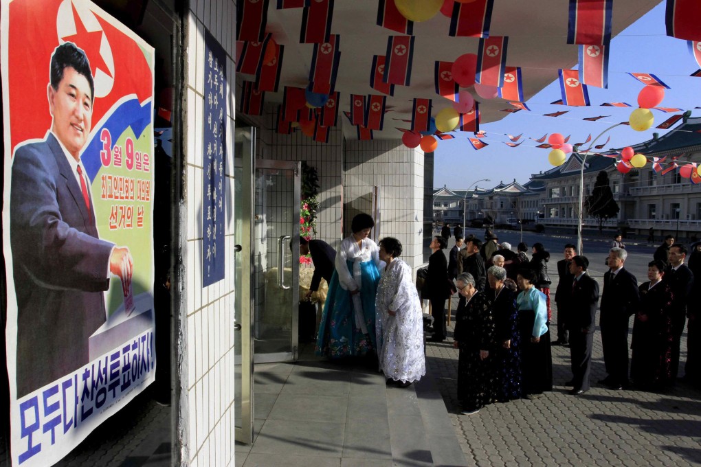 Voters line up to cast ballots to elect deputies to a new national legislature in Pyongyang. The official turnout for the election in 2009 was put at 99.98 per cent. Photo: AP
