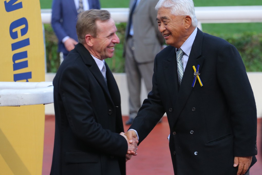 John Size is congratulated by Larry Yung Chi-kin after recording 800 wins with Mirage. Photos: Kenneth Chan