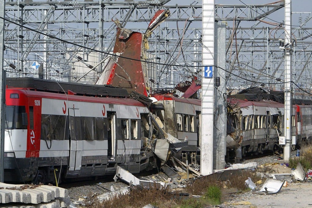 Damaged commuter train carriages are seen following a terror bombing at the Atocha train station in Madrid 11 March 2004. Photo: AFP