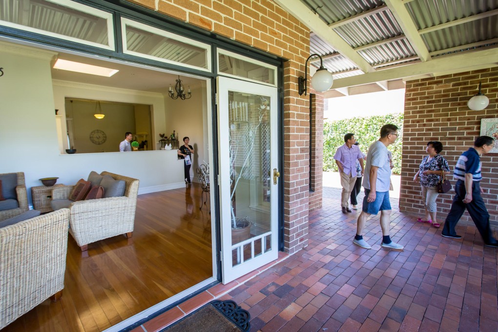 Potential buyers view a suburban house in Sydney. Price rises are partly being driven by Chinese demand. Photo: Bloomberg