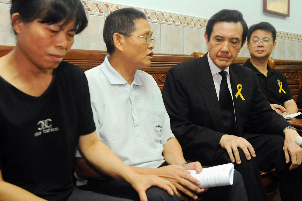 Taiwanese President Ma Ying-jeou (third from left) listens to Hung Chi-tuan, the father of Hung Chung-chiu in August. Photo: AFP
