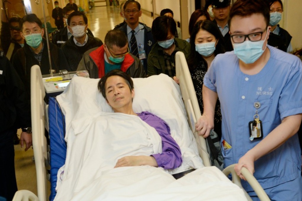 Kevin Lau Chun-to leaving intensive care on March 3. Photo: AP