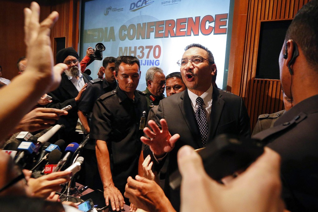 Malaysian transport minister Hishammuddin bin Tun Hussein is bombarded with questions at yesterday's news conference. Photo: Reuters