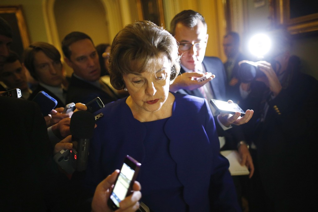 Senator Dianne Feinstein is trailed by reporters in Washington before accusing the CIA of illegal spying. Photo: Reuters