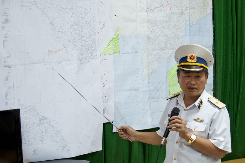 Vietnamese Navy Deputy Commander Le Minh Thanh speaks to reporters on search activities conducted by Vietnam to trace the missing Malaysia Airlines flight 370. Photo: Xinhua