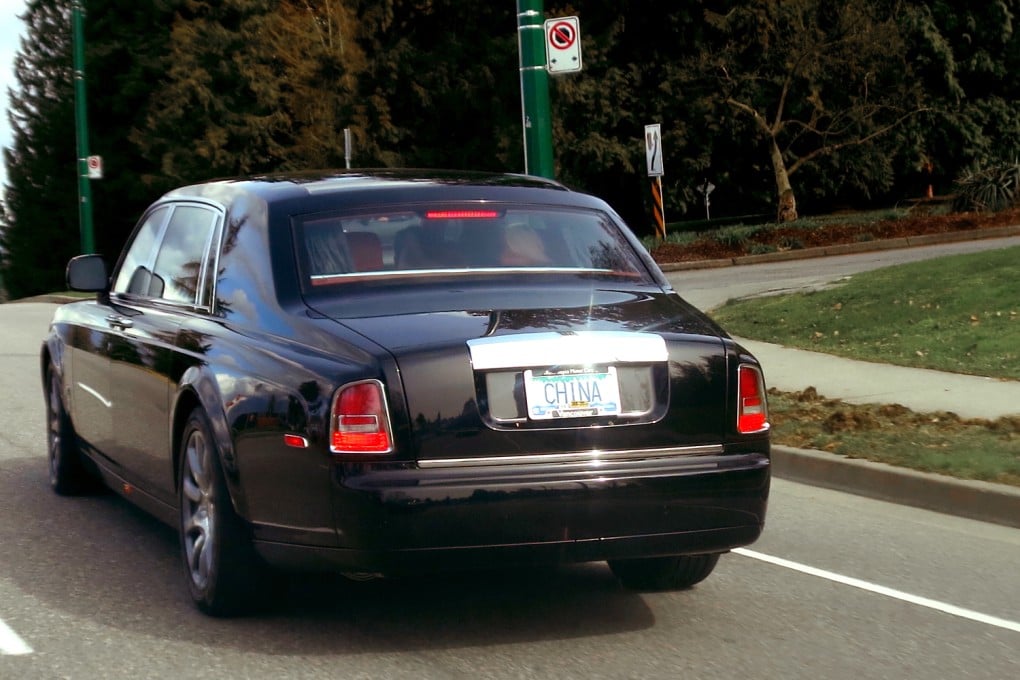 A Roll-Royce Phantom with a personalised licence plate cruises down Vancouver’s Cambie Street on Sunday, March 9. Photo: Ian Young
