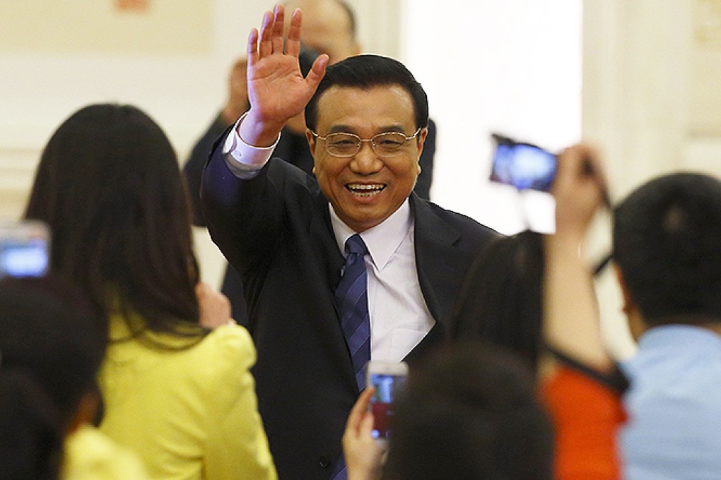 Premier Li Keqiang waves after wrapping up the NPC meeting. Photo: EPA