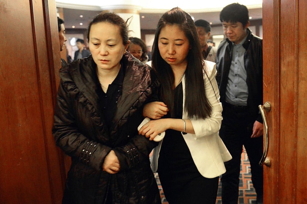 Relatives of passengers aboard missing Flight MH370 look dejected as they leave a hotel lounge in Beijing after failing to receive any encouraging news in their meeting with Malaysian officials. Photo: AFP
