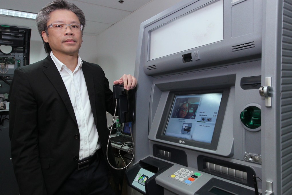 Keith Au says NCR's new interactive ATMs help speed up the transaction process, especially for the elderly. Photo: Edmond So