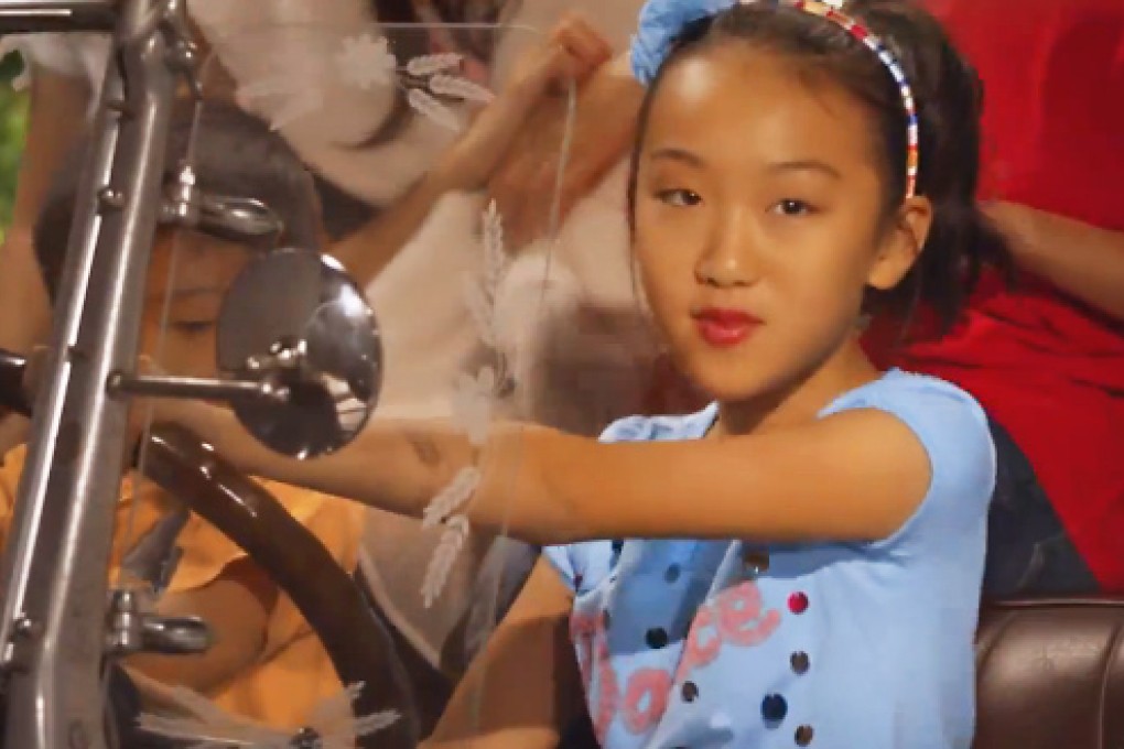 10-year-old Grace Liu flaunts underage driving laws in her new music video. Photo: SCMP Pictures