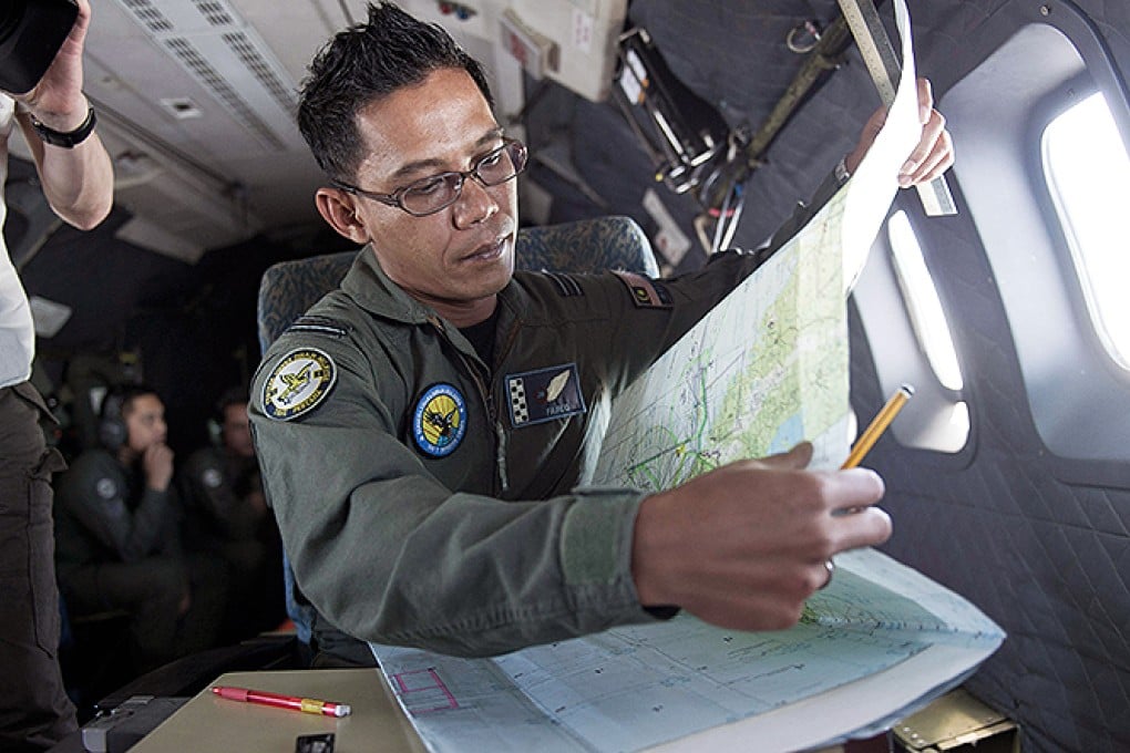 A navigator from the Royal Malaysian Air Force co-ordinates a search of the Strait of Malacca. Photo: AFP. Photo: AFP