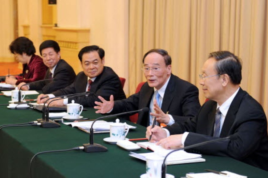 Wang Rulin, third left, and Wang Qishan, at the meeting where the Jilin province party boss was later upbraided. Photo: Xinhua