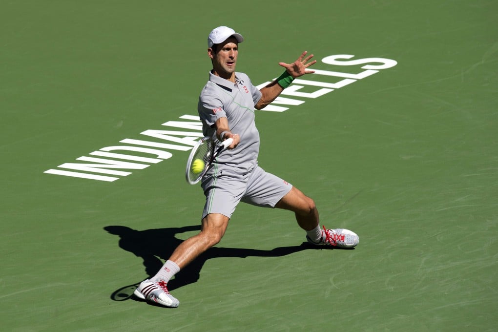 Novak Djokovic returns to Frenchman  Julien Benneteau at the BNP Paribas Open. Photo: EPA