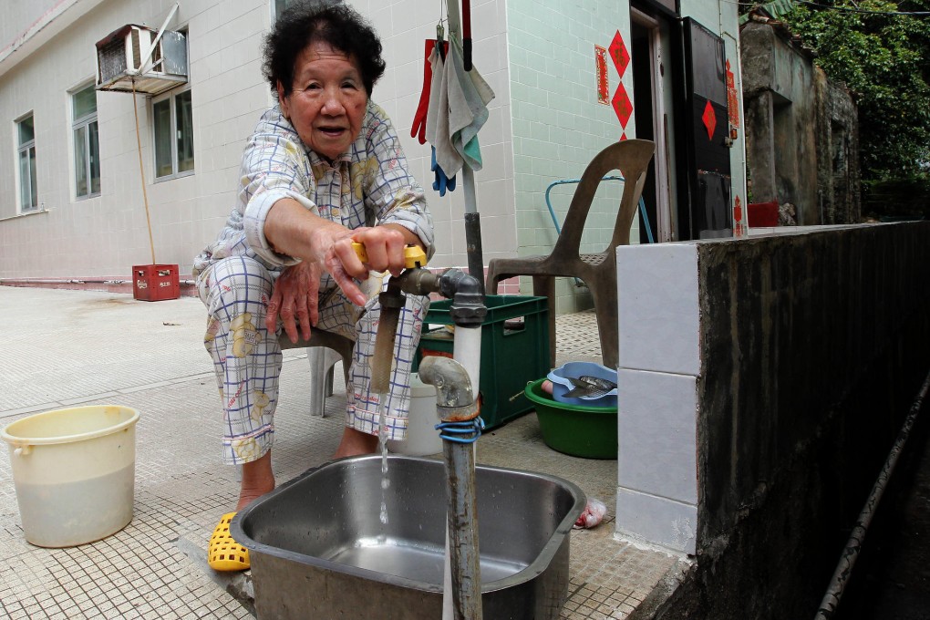 Yu Yuk-chun stores water at Tai Long Wan village. Photo: Edward Wong